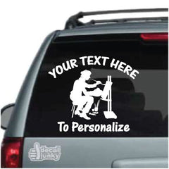 creative-artist-painting-vinyl-decal-on-car-window-bumper