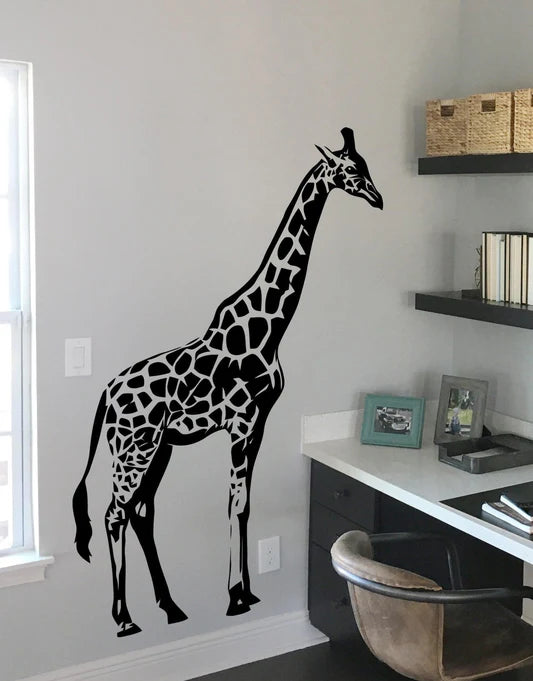 A black decal of a giraffe on a white  Die Cut Vinyl Decal