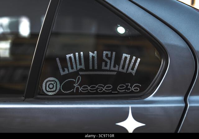car window displaying a low n slow sticker  Die Cut Vinyl Decal
