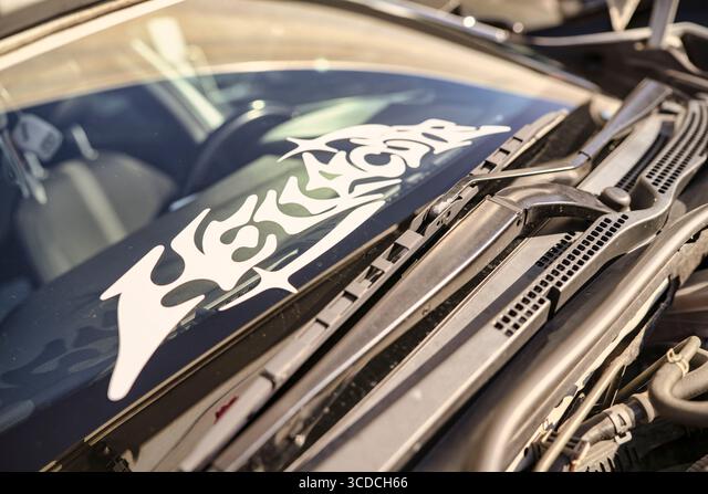 white hellacore sticker affixed to a car windshield Die Cut Vinyl Decal