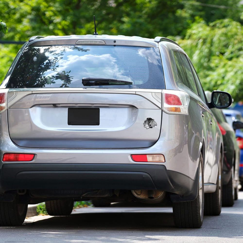 chrome-sports-emblem-vinyl-decal-on-truck-laptop
