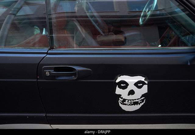 Sticker of a human skeleton on the side of a car Die Cut Vinyl Decal