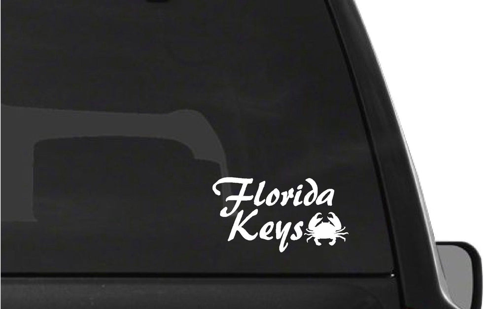 florida‑keys‑vinyl‑sticker‑applied‑on‑car‑window‑and‑laptop